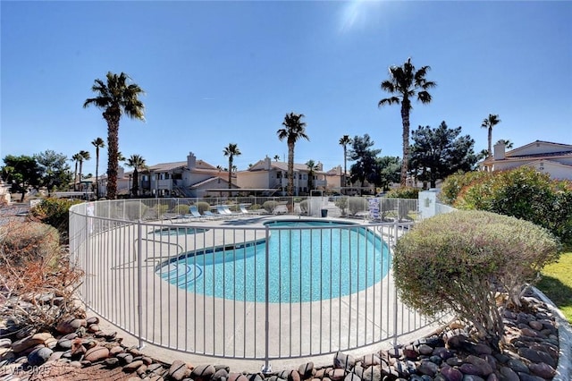 7952 Diamond Rock Way Unit 102, Las Vegas, NV 89128 - community pool featuring a residential view and a patio