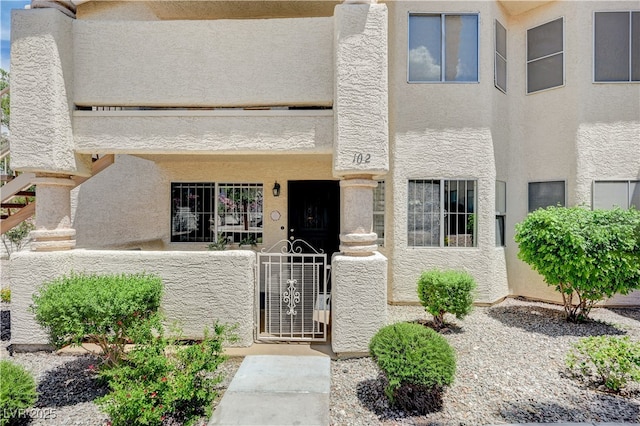 7952 Diamond Rock Way Unit 102, Las Vegas, NV 89128 - view of front of property with stucco siding and a gate
