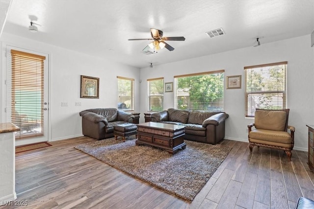 7252 Royal Melbourne Dr, Las Vegas, NV 89131 - living area with wood finished floors, ceiling fan, and baseboards