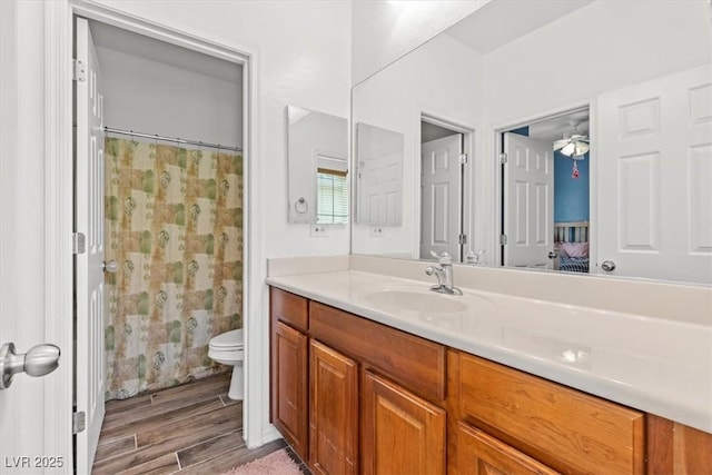 7252 Royal Melbourne Dr, Las Vegas, NV 89131 - full bathroom with vanity, toilet, wood finished floors, and a shower with shower curtain