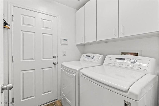 7252 Royal Melbourne Dr, Las Vegas, NV 89131 - washroom with washer and dryer, cabinet space, and dark wood finished floors