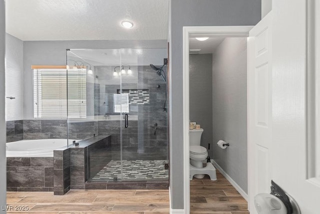 7252 Royal Melbourne Dr, Las Vegas, NV 89131 - bathroom with toilet, a garden tub, a shower stall, and wood finished floors