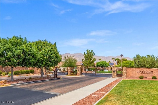 7252 Royal Melbourne Dr, Las Vegas, NV 89131 - view of home's community with a gate and a mountain view