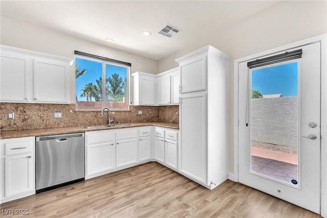 690 Great Dane Ct, Henderson, NV 89052 - kitchen with dishwasher, light wood-style floors, white cabinetry, decorative backsplash, and stone counters