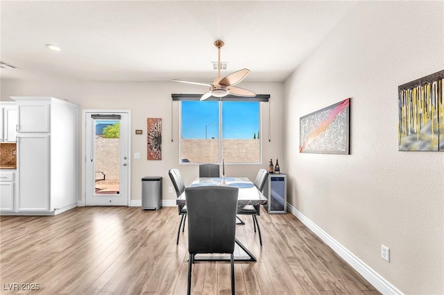 690 Great Dane Ct, Henderson, NV 89052 - dining area with light wood-style flooring and ceiling fan