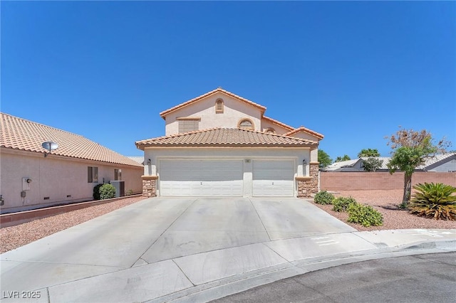 690 Great Dane Ct, Henderson, NV 89052 - mediterranean / spanish-style house featuring stone siding, concrete driveway, a tile roof, and a garage