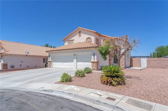 690 Great Dane Ct, Henderson, NV 89052 - mediterranean / spanish-style house featuring stone siding, a garage, stucco siding, driveway, and a tile roof