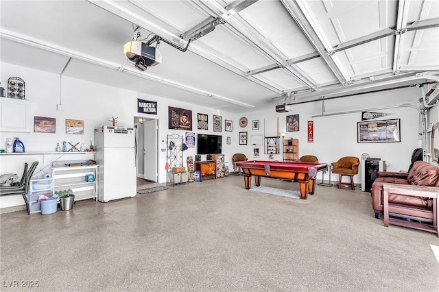 690 Great Dane Ct, Henderson, NV 89052 - garage with freestanding refrigerator and a garage door opener