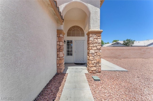 690 Great Dane Ct, Henderson, NV 89052 - doorway to property with stucco siding and stone siding