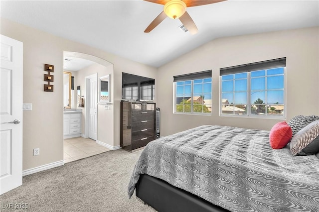 690 Great Dane Ct, Henderson, NV 89052 - bedroom with lofted ceiling, arched walkways, carpet flooring, connected bathroom, and ceiling fan