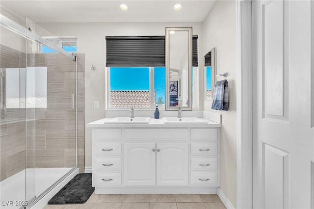 690 Great Dane Ct, Henderson, NV 89052 - bathroom featuring a shower stall, double vanity, tile patterned floors, and recessed lighting