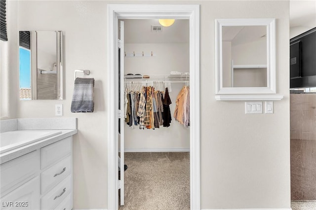 690 Great Dane Ct, Henderson, NV 89052 - bathroom with vanity and a walk in closet