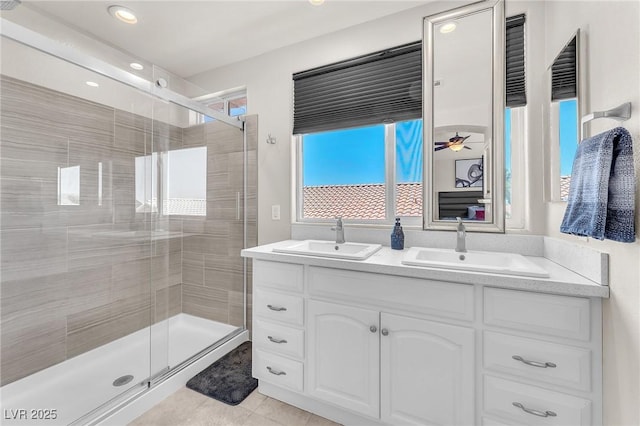 690 Great Dane Ct, Henderson, NV 89052 - bathroom with double vanity, a shower stall, tile patterned floors, and recessed lighting