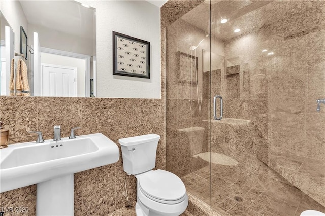 690 Great Dane Ct, Henderson, NV 89052 - bathroom featuring a stall shower and tile walls