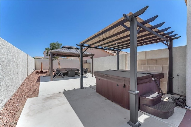 690 Great Dane Ct, Henderson, NV 89052 - fenced backyard featuring a hot tub, a gazebo, a patio, a pergola, and an outdoor hangout area