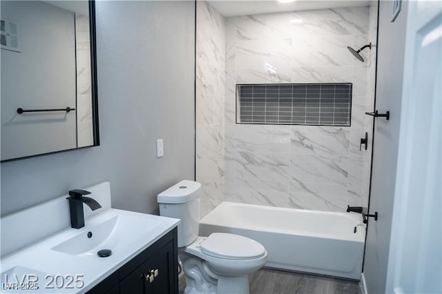 1440 Vegas Valley Dr Unit 3, Las Vegas, NV 89169 - bathroom featuring vanity, toilet,  shower combination, and wood finished floors