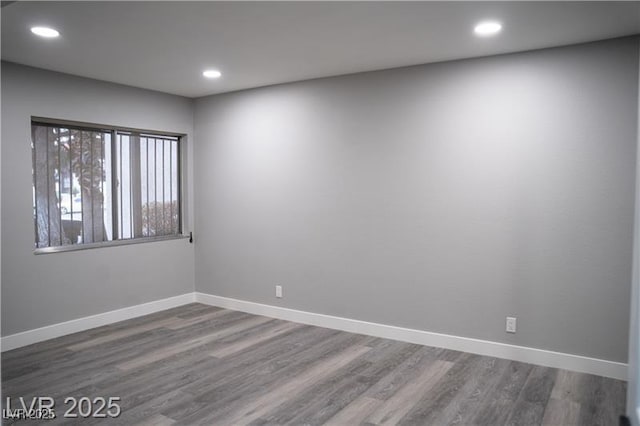 1440 Vegas Valley Dr Unit 3, Las Vegas, NV 89169 - empty room featuring baseboards, wood finished floors, and recessed lighting