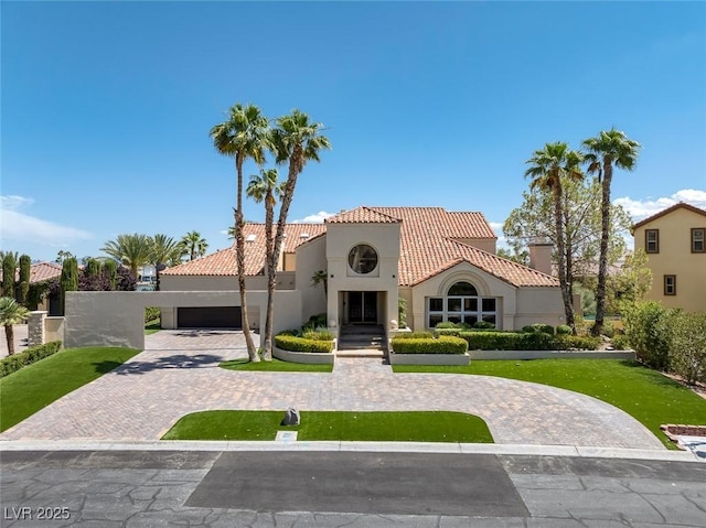 2925 Coast Line Ct, Las Vegas, NV 89117 - mediterranean / spanish-style home with a tiled roof, stucco siding, and decorative driveway