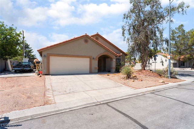 4335 Twin Peaks Dr, North Las Vegas, NV 89032 - mediterranean / spanish-style house with stucco siding, an attached garage, and concrete driveway