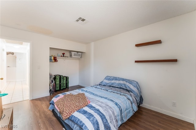 4335 Twin Peaks Dr, North Las Vegas, NV 89032 - bedroom featuring wood finished floors and a closet