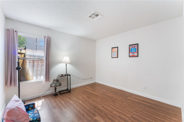4335 Twin Peaks Dr, North Las Vegas, NV 89032 - unfurnished room featuring wood finished floors and a textured ceiling