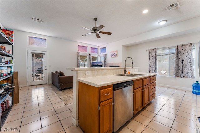4335 Twin Peaks Dr, North Las Vegas, NV 89032 - kitchen with dishwasher, a ceiling fan, light countertops, open floor plan, and light tile patterned flooring
