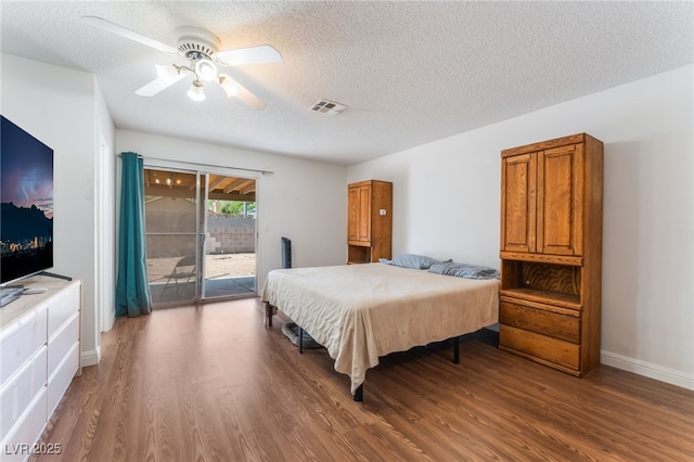 4335 Twin Peaks Dr, North Las Vegas, NV 89032 - bedroom with access to outside, wood finished floors, a textured ceiling, and a ceiling fan