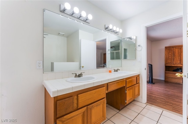 4335 Twin Peaks Dr, North Las Vegas, NV 89032 - full bathroom with double vanity and tile patterned floors