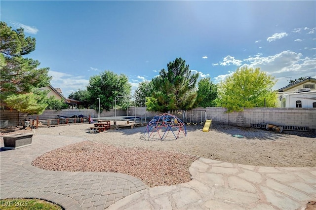 6821 Jeanette St, Las Vegas, NV 89131 - fenced backyard featuring a playground