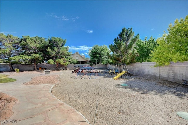 6821 Jeanette St, Las Vegas, NV 89131 - fenced backyard featuring a playground