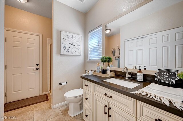 6821 Jeanette St, Las Vegas, NV 89131 - full bath featuring toilet, vanity, tile patterned flooring, baseboards, and a shower