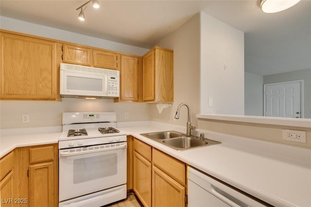 350 S Durango Dr Unit 103, Las Vegas, NV 89145 - kitchen featuring white appliances, a sink, light countertops, and light brown cabinets