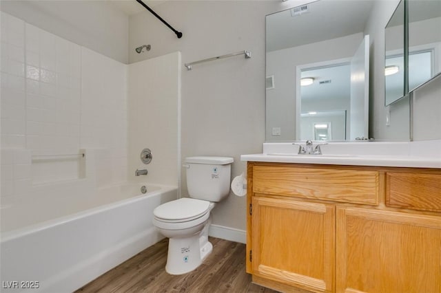 350 S Durango Dr Unit 103, Las Vegas, NV 89145 - bathroom featuring toilet, shower / tub combination, wood finished floors, vanity, and baseboards