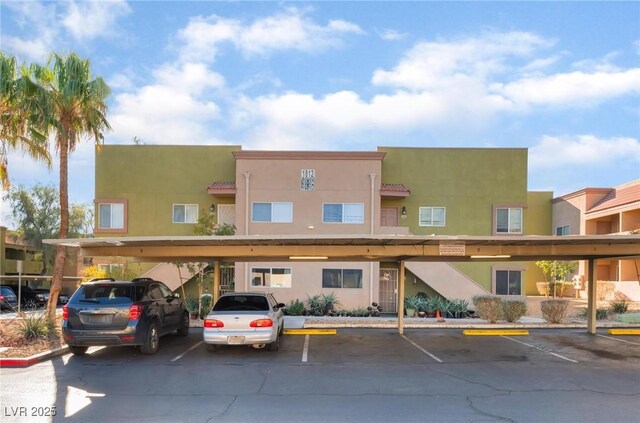 1812 N Decatur Blvd Unit 103, Las Vegas, NV 89108 - view of property featuring covered parking