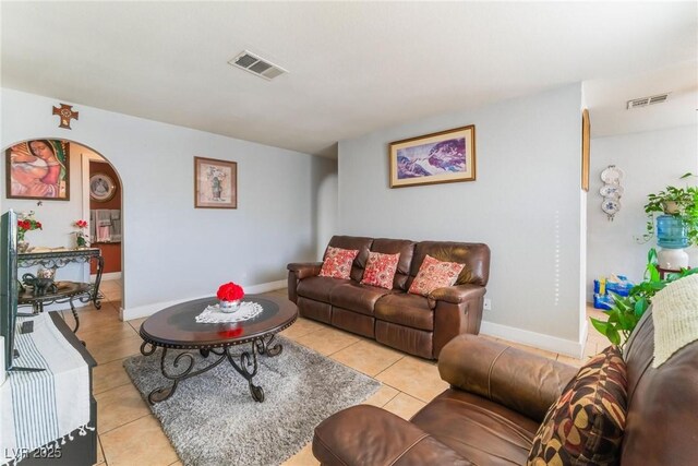 1812 N Decatur Blvd Unit 103, Las Vegas, NV 89108 - living room with light tile patterned floors and arched walkways