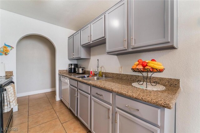 1812 N Decatur Blvd Unit 103, Las Vegas, NV 89108 - kitchen featuring gray cabinets, dishwasher, electric stove, arched walkways, and light tile patterned floors