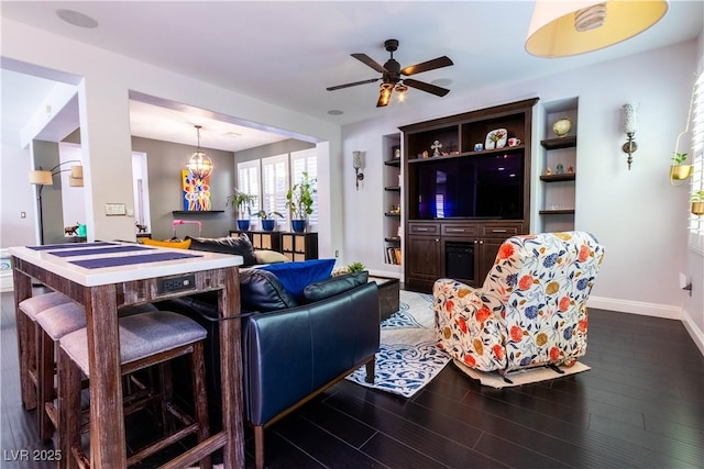 10526 Harvest Wind Dr, Las Vegas, NV 89135 - living area with wood finished floors, baseboards, and a ceiling fan