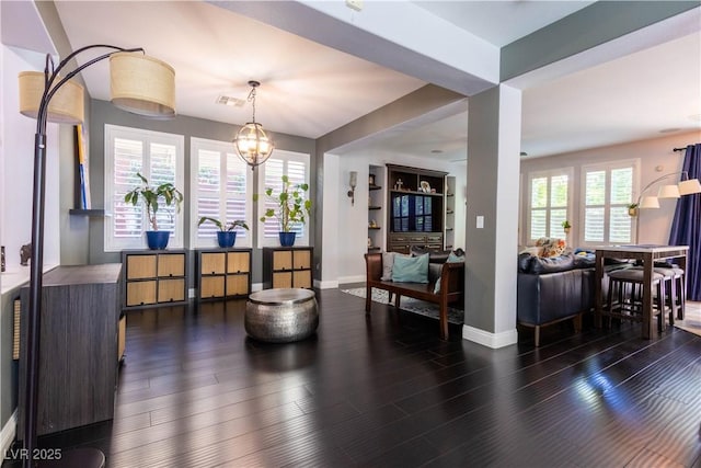 10526 Harvest Wind Dr, Las Vegas, NV 89135 - dining space with baseboards and dark wood finished floors