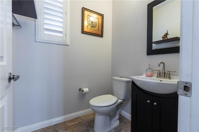 10526 Harvest Wind Dr, Las Vegas, NV 89135 - bathroom featuring vanity, toilet, and baseboards