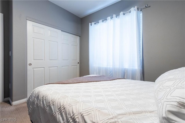 10526 Harvest Wind Dr, Las Vegas, NV 89135 - bedroom featuring a closet, carpet flooring, and baseboards