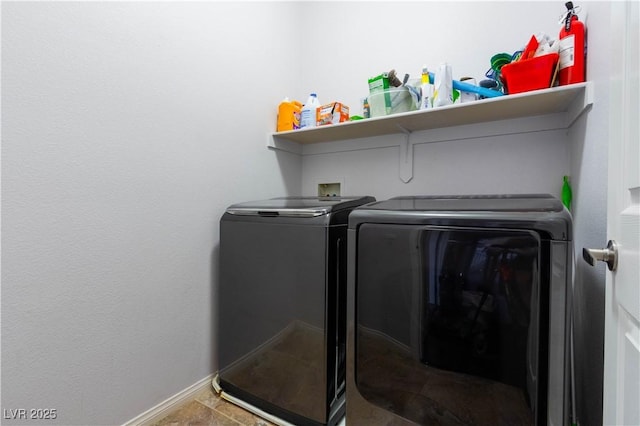 10526 Harvest Wind Dr, Las Vegas, NV 89135 - washroom featuring washer and dryer and baseboards