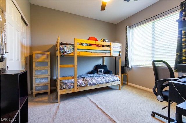 10526 Harvest Wind Dr, Las Vegas, NV 89135 - carpeted bedroom with baseboards, an office area, a ceiling fan, and a closet