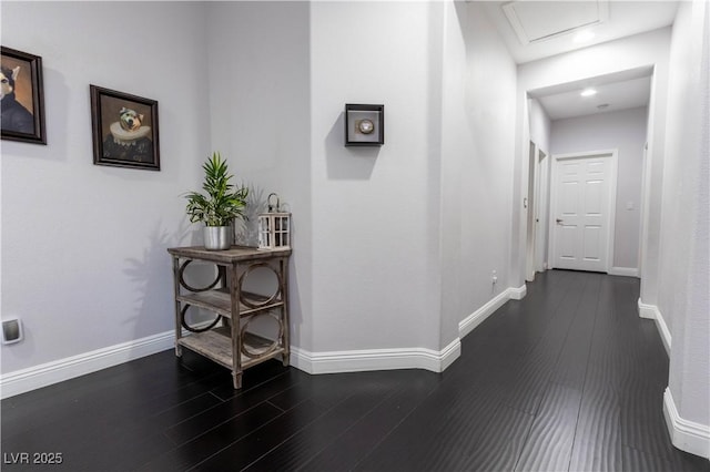 10526 Harvest Wind Dr, Las Vegas, NV 89135 - hallway featuring dark wood-style flooring, attic access, and baseboards