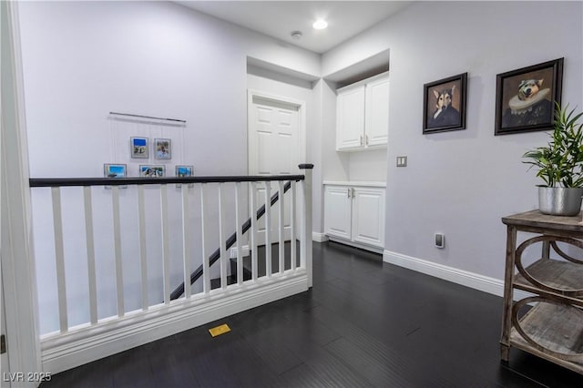 10526 Harvest Wind Dr, Las Vegas, NV 89135 - hallway with an upstairs landing, dark wood finished floors, baseboards, and recessed lighting