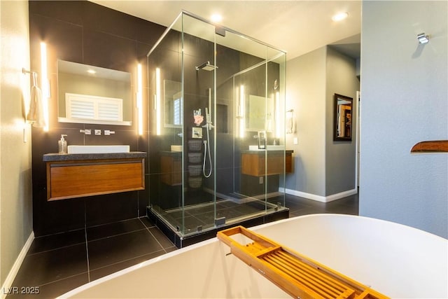 10526 Harvest Wind Dr, Las Vegas, NV 89135 - bathroom with a soaking tub, a stall shower, vanity, and tile patterned floors