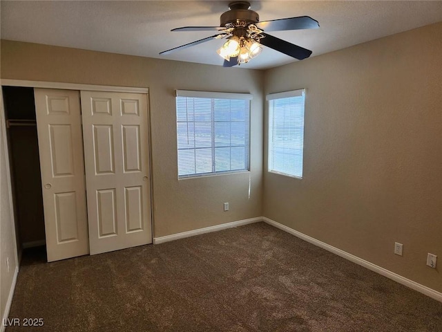 5605 Midnight Breeze St, North Las Vegas, NV 89081 - unfurnished bedroom featuring dark colored carpet, a closet, and ceiling fan