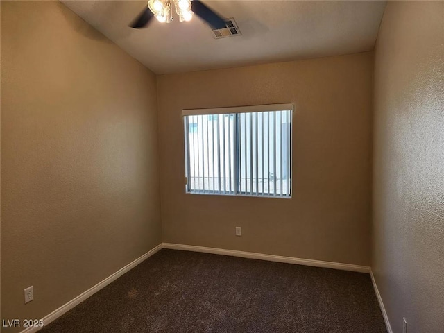 5605 Midnight Breeze St, North Las Vegas, NV 89081 - empty room with ceiling fan and dark colored carpet