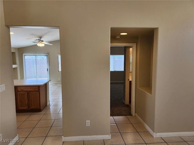 5605 Midnight Breeze St, North Las Vegas, NV 89081 - corridor featuring light tile patterned floors and vaulted ceiling