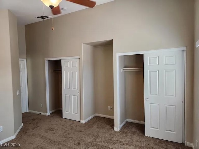 5605 Midnight Breeze St, North Las Vegas, NV 89081 - unfurnished bedroom with two closets and carpet flooring