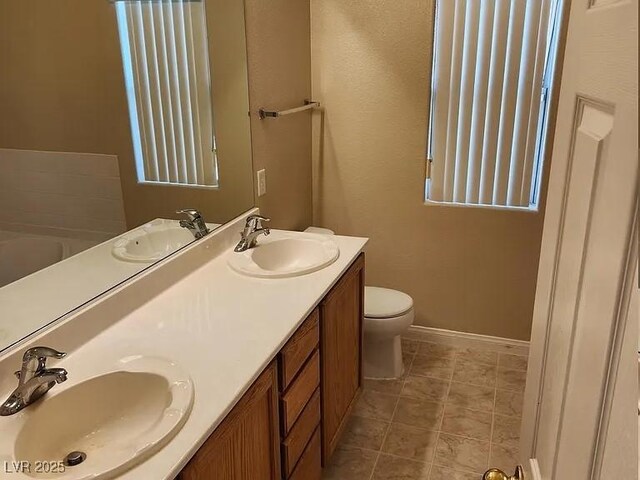 5605 Midnight Breeze St, North Las Vegas, NV 89081 - full bath featuring double vanity and tile patterned floors